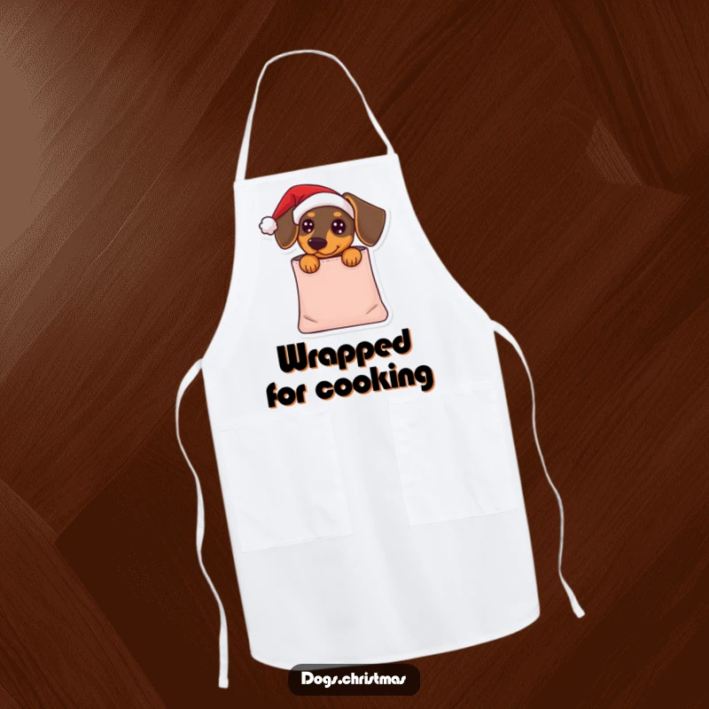 Funny Dachshund Apron: A dachshund in a Santa hat peeks from a gift bag, perfect for chefs who love humorous holiday designs.