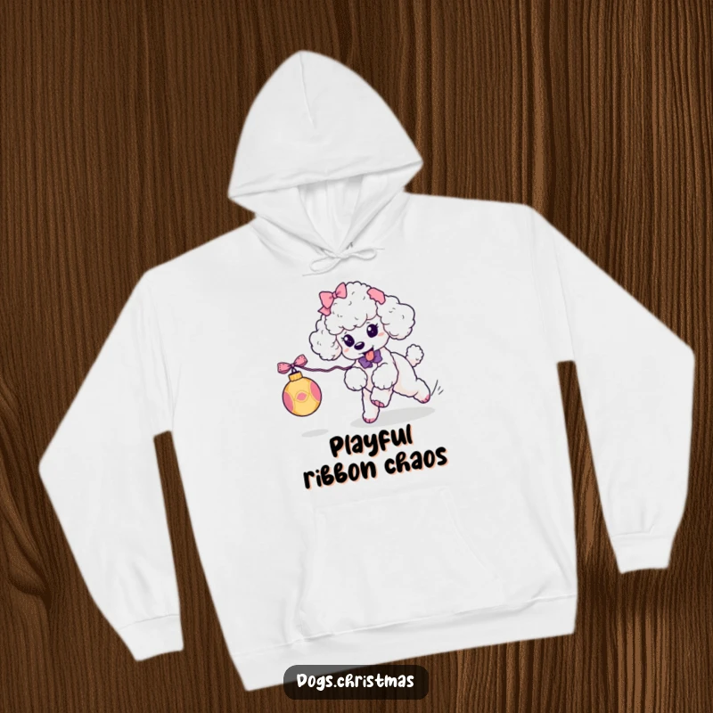 Funny Kawaii Poodle Hoodie: A cute poodle with bows playfully chases a festive ornament, ideal for humorous winter wear.