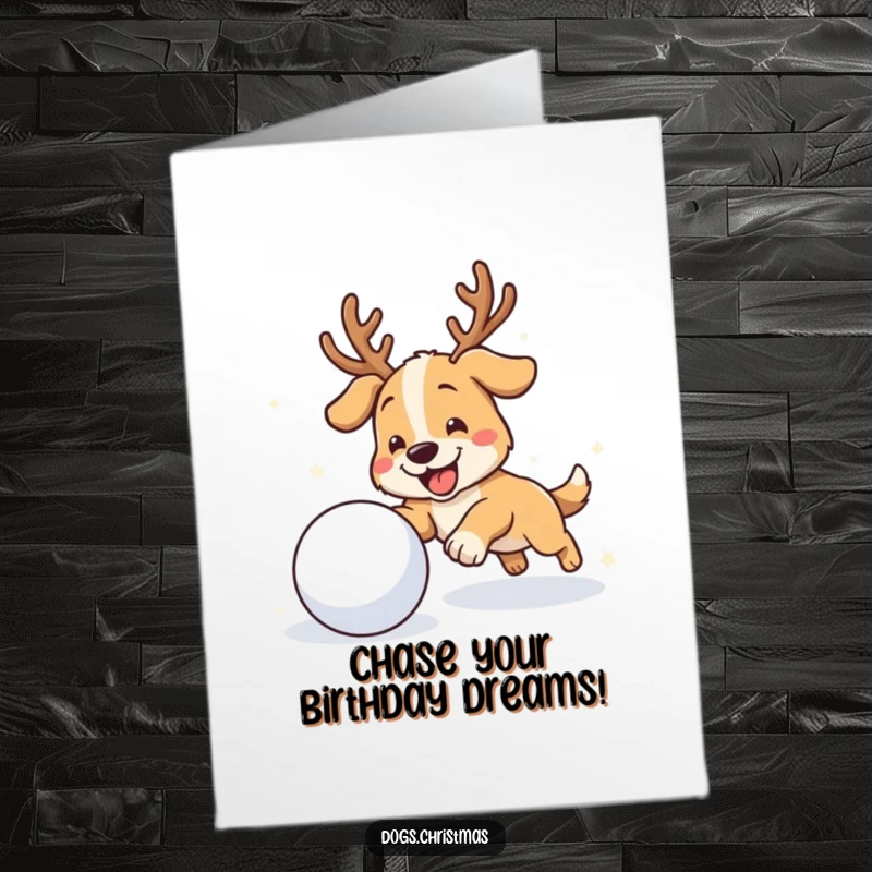 Funny Free Printable Birthday Card: A dog with antlers gleefully chases a rolling snowball in the snow.