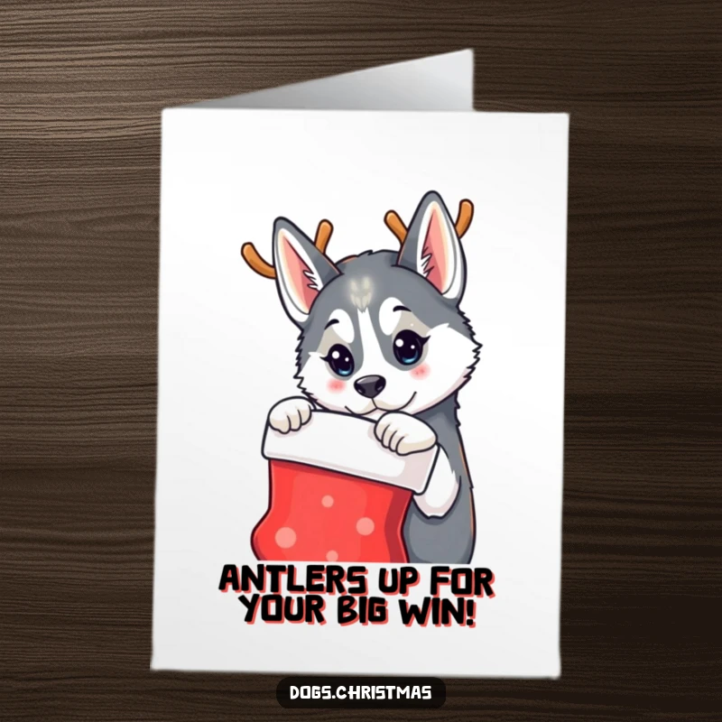 Funny Free Printable Congratulations Card: A husky in reindeer antlers looks at a stocking, bringing holiday whimsy to your well wishes.