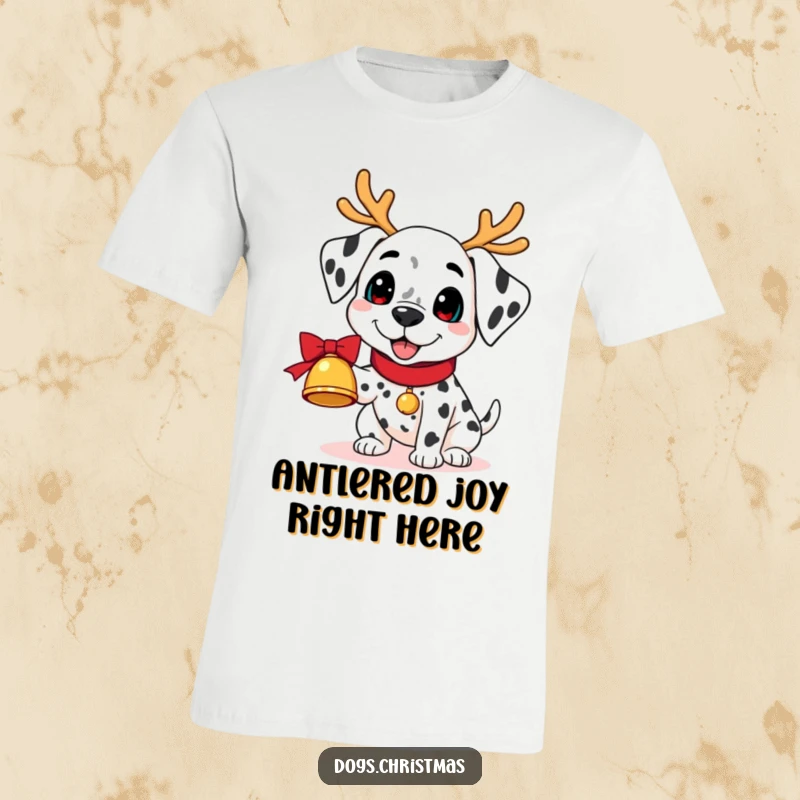 Funny Kawaii Dalmatian T-Shirt: A dalmatian wearing reindeer antlers joyfully holds a jingling bell, a humorous and festive design.